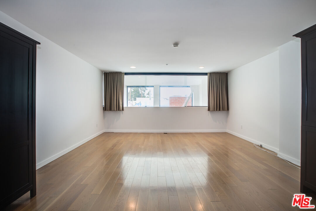 700 Main Street, Unit 5 Venice, CA 90291 - Photo 15 of 28 an empty room with wooden floor and windows
