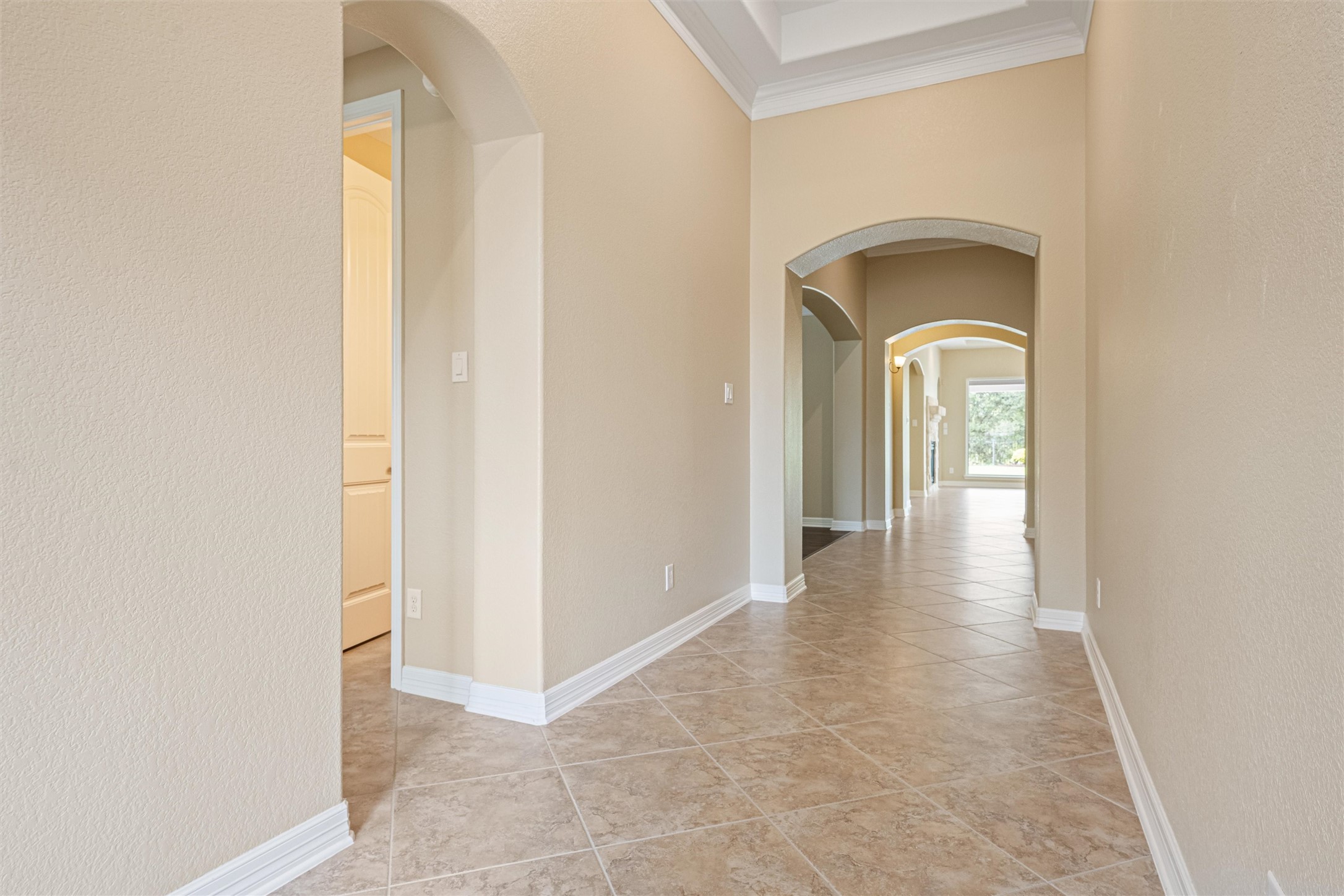 27714 Linden Ridge Lane Fulshear, TX 77441 - Photo 16 of 48 The entry features tiled floor and beautiful tray ceiling details.