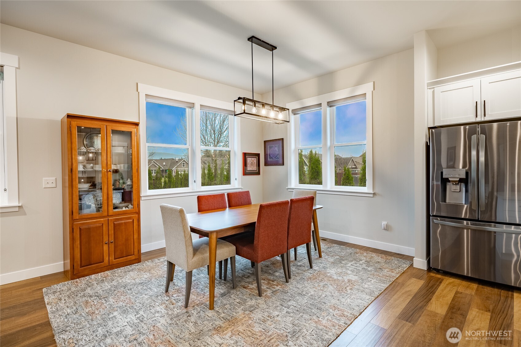 2202 Berryman Loop Lynden, WA 98264 - Photo 11 of 39 a view of a dining room with furniture window and wooden floor