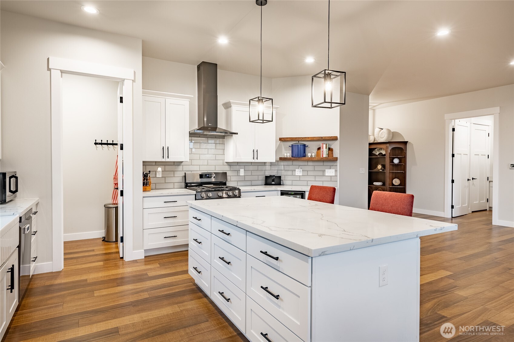 2202 Berryman Loop Lynden, WA 98264 - Photo 18 of 39 a kitchen with white cabinets and stainless steel appliances