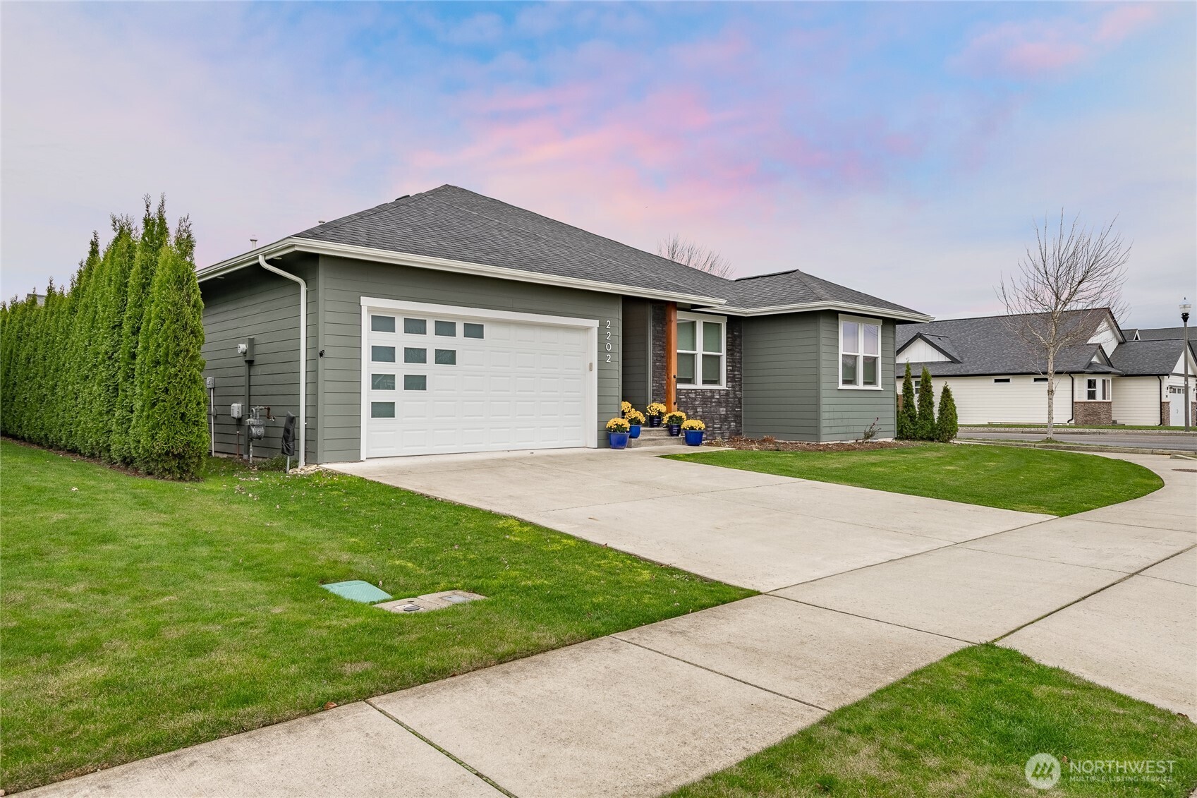 2202 Berryman Loop Lynden, WA 98264 - Photo 2 of 39 a front view of a house with a yard and garage