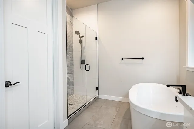 a bathroom with a sink and shower