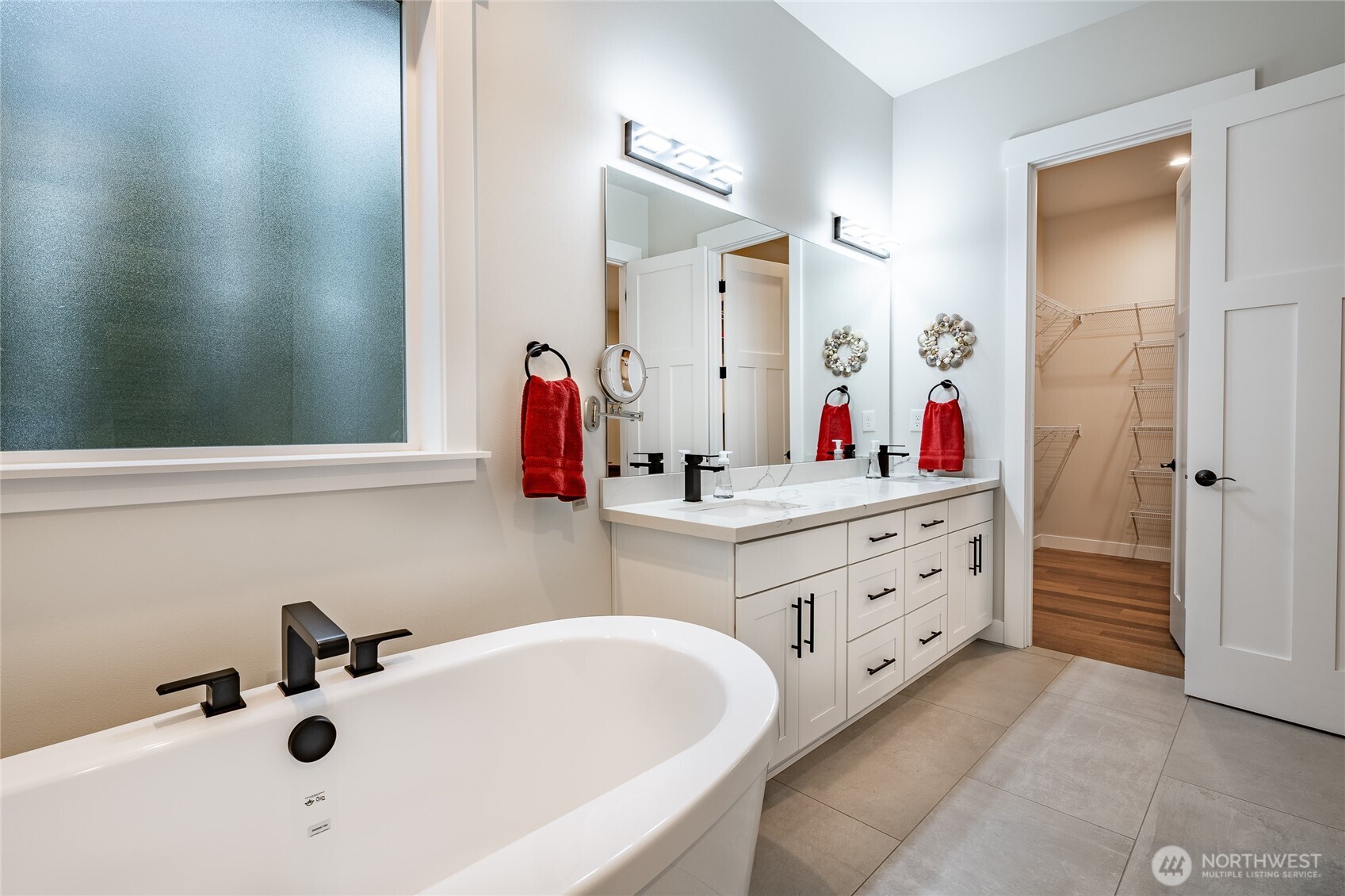 2202 Berryman Loop Lynden, WA 98264 - Photo 24 of 39 a bathroom with a tub sink and mirror