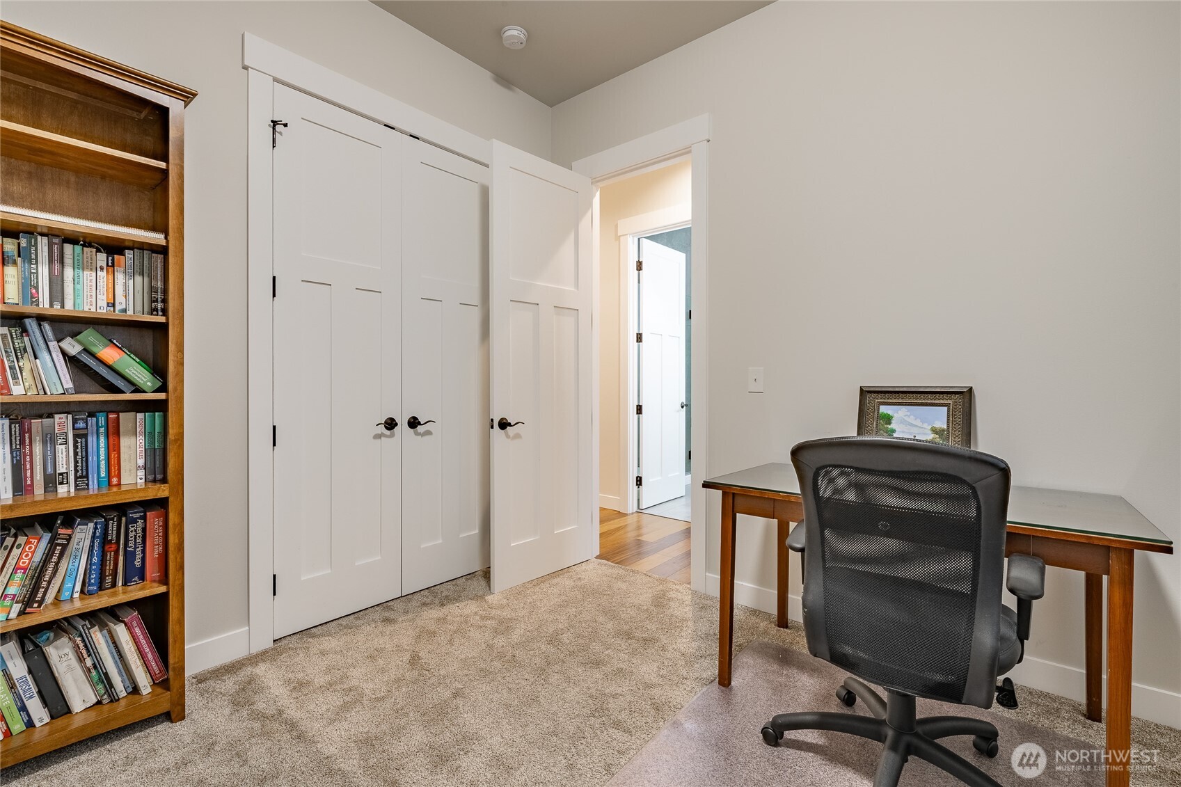 2202 Berryman Loop Lynden, WA 98264 - Photo 27 of 39 a view of a workspace with furniture and a book shelf