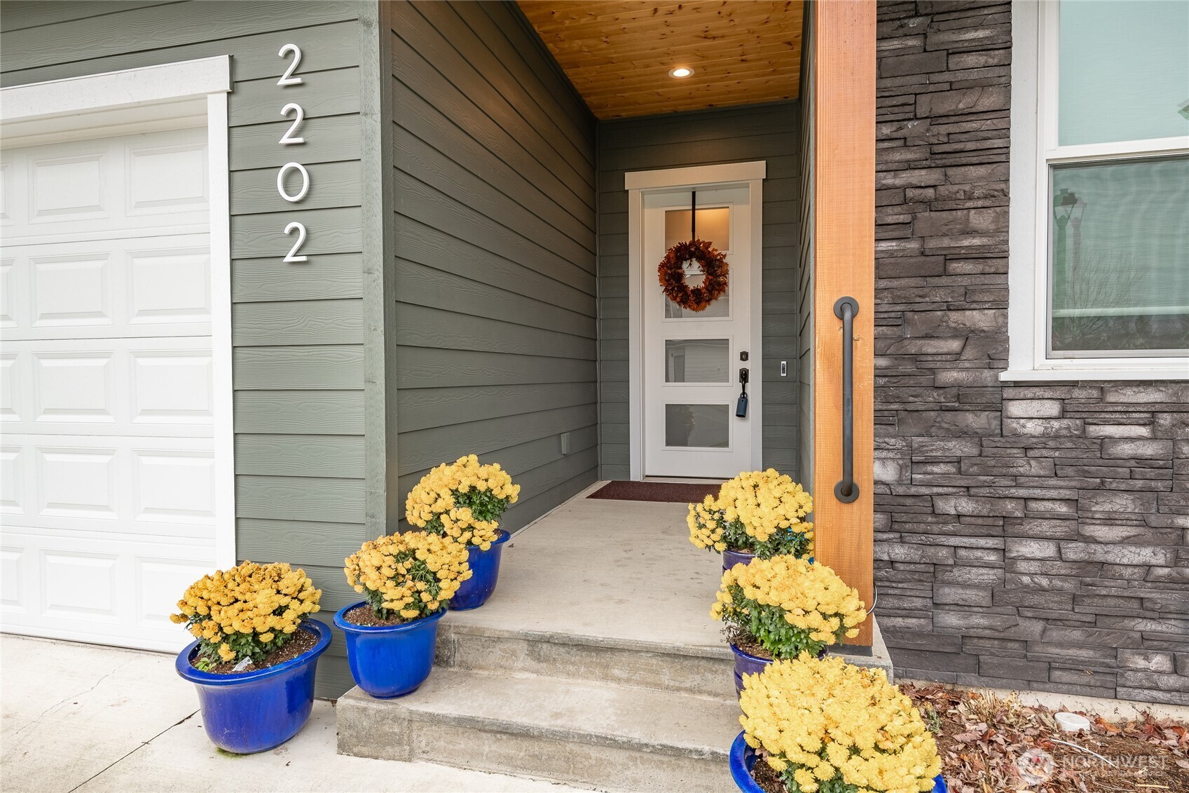 2202 Berryman Loop Lynden, WA 98264 - Photo 3 of 39 a front view of a house with outdoor seating