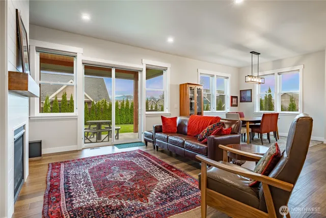 a living room with furniture and a rug