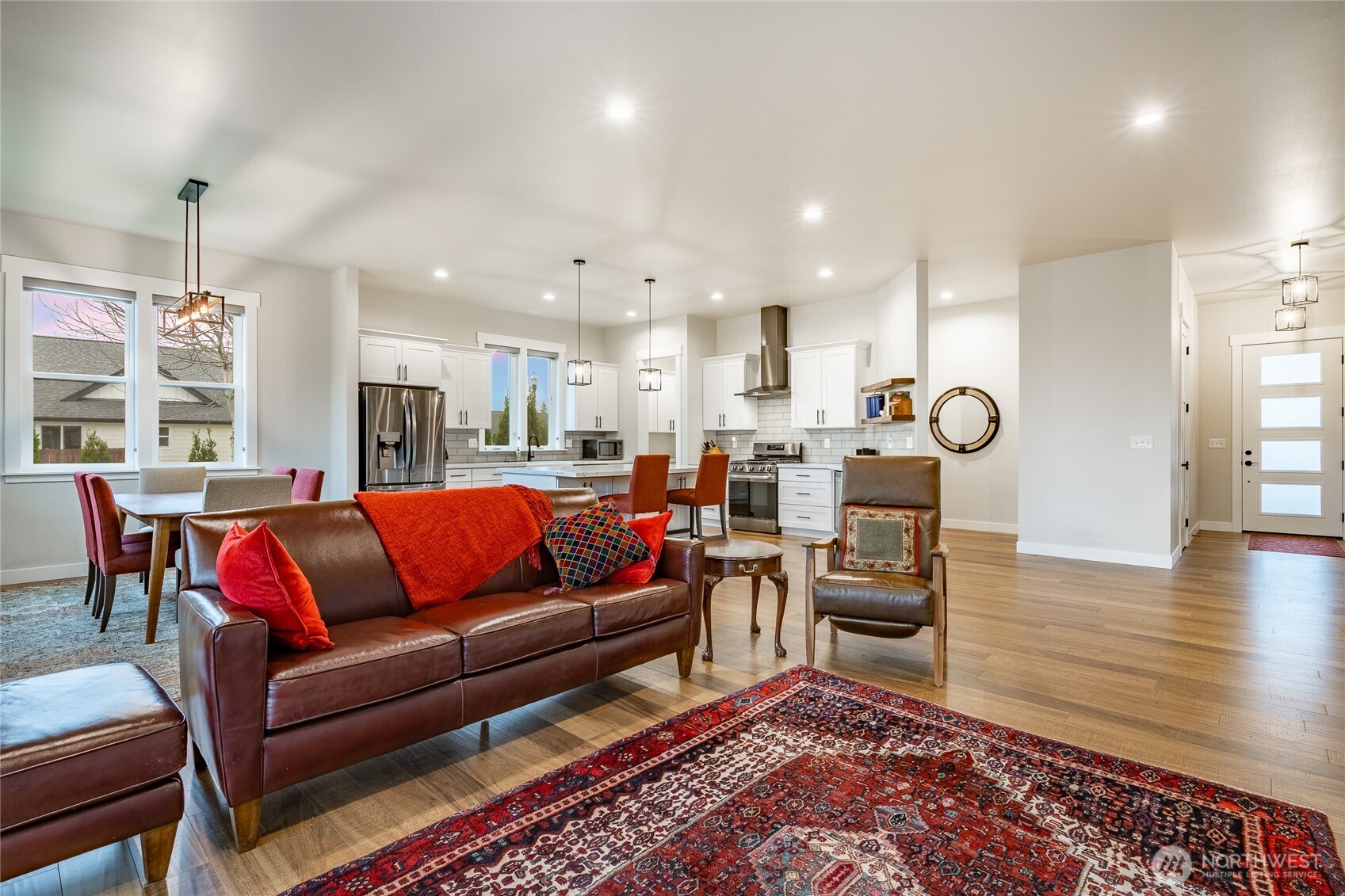 2202 Berryman Loop Lynden, WA 98264 - Photo 8 of 39 a living room kitchen with furniture and a wooden floor
