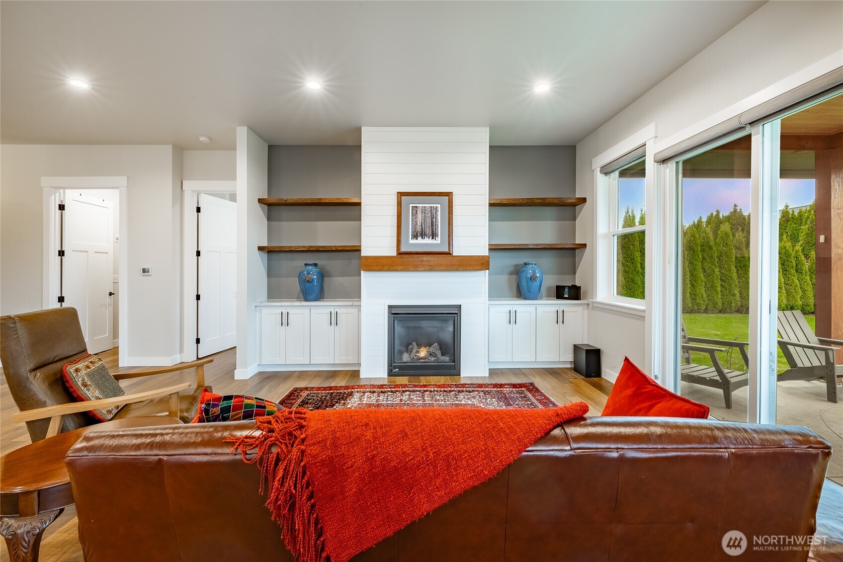 2202 Berryman Loop Lynden, WA 98264 - Photo 10 of 39 a living room with furniture a fireplace and city view