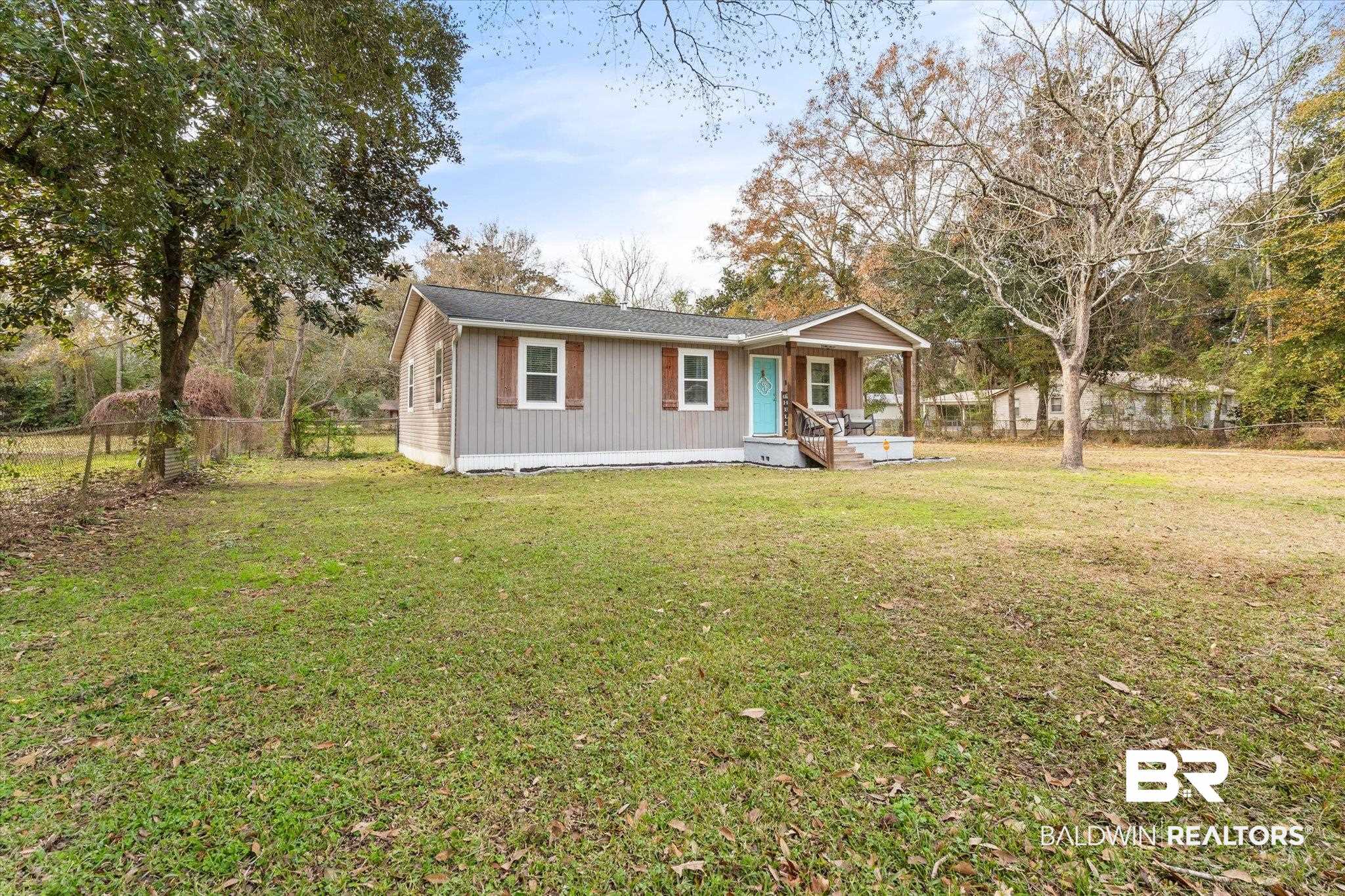 419 Pierce Street Saraland, AL 36571 - Photo 19 of 21 View of front of house with covered porch and a front yard