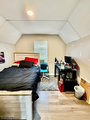 a living room with furniture and a dresser