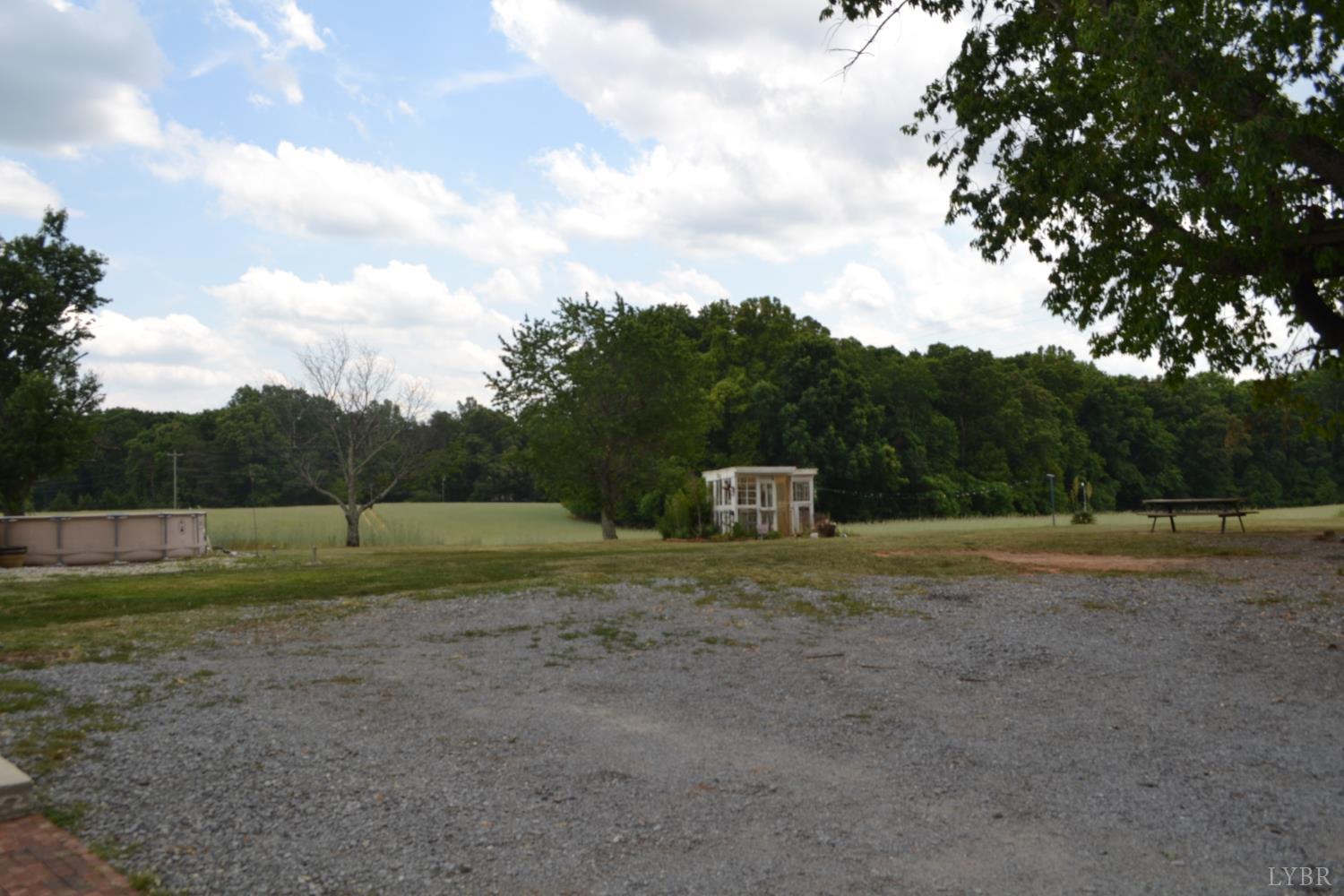 6387 Red House Road Rustburg, VA 24588 - Photo 12 of 38 a view of dirt field with large trees