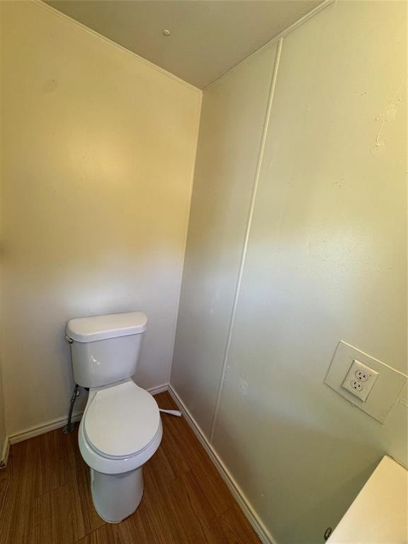 2014 Spring Court Azle, TX 76020 - Photo 9 of 16 a bathroom with a toilet and a sink