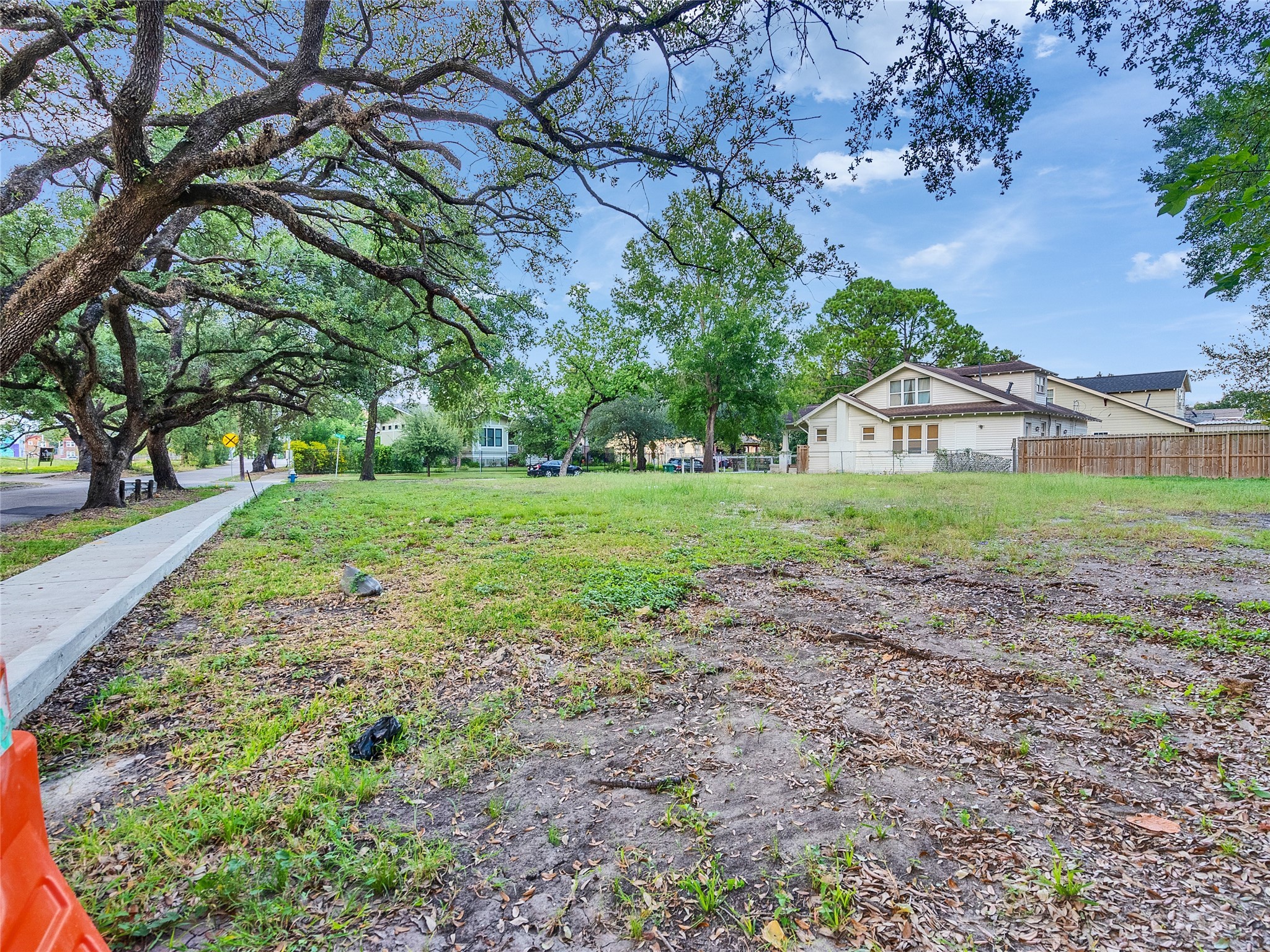 4402 Rusk Street Houston, TX 77023 - Photo 2 of 9 a view of a big yard with plants and large trees