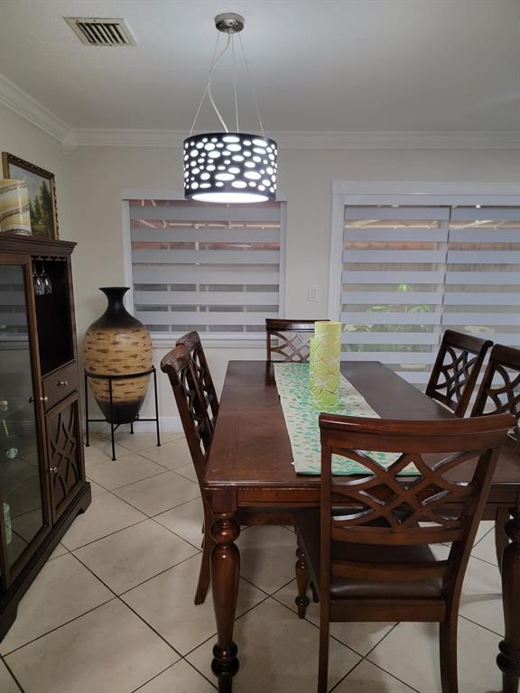 11821 Southwest 18th Street, Unit 223 Miami, FL 33175 - Photo 11 of 31 a view of a dining room with furniture