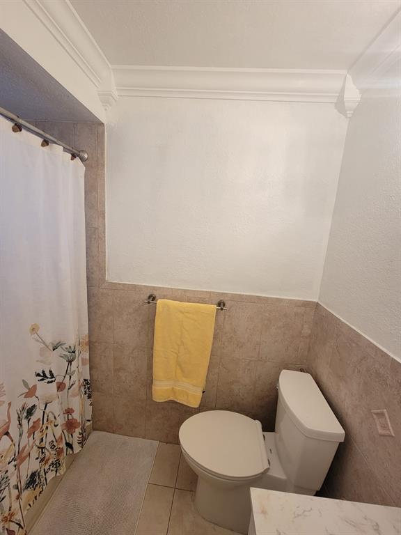 11821 Southwest 18th Street, Unit 223 Miami, FL 33175 - Photo 19 of 31 a white toilet sitting next to a bathroom sink