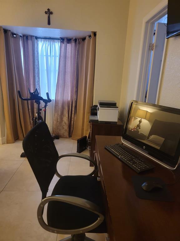 11821 Southwest 18th Street, Unit 223 Miami, FL 33175 - Photo 22 of 31 a living room with furniture and a window