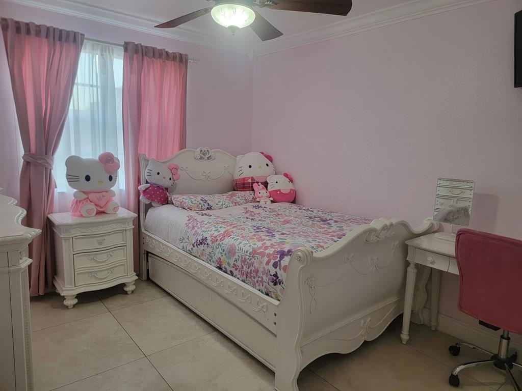 11821 Southwest 18th Street, Unit 223 Miami, FL 33175 - Photo 25 of 31 a bedroom with a bed and a window