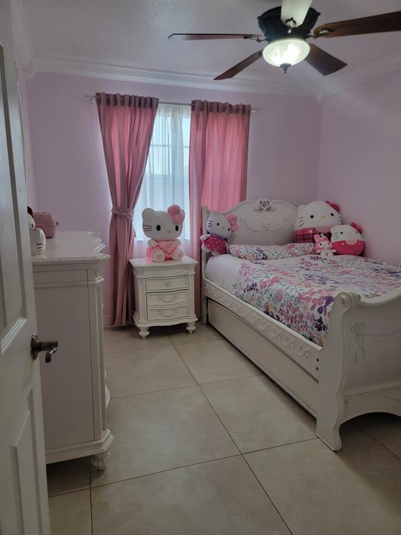11821 Southwest 18th Street, Unit 223 Miami, FL 33175 - Photo 26 of 31 a bedroom with a bed and a chandelier