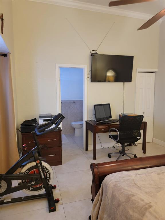 11821 Southwest 18th Street, Unit 223 Miami, FL 33175 - Photo 29 of 31 a room with a couch and a flat screen tv