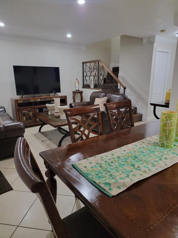 11821 Southwest 18th Street, Unit 223 Miami, FL 33175 - Photo 3 of 31 a living room with furniture and a flat screen tv