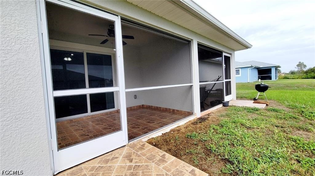 152 Pullman Street Lehigh Acres, FL 33974 - Photo 13 of 15 a view of backyard with tub
