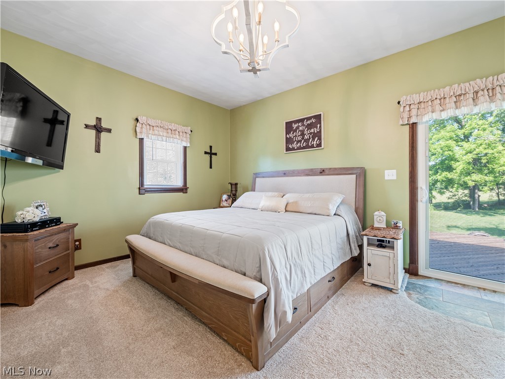 5245 Center Road Philo, OH 43771 - Photo 15 of 39 Bedroom with new chandelier and access to exterior