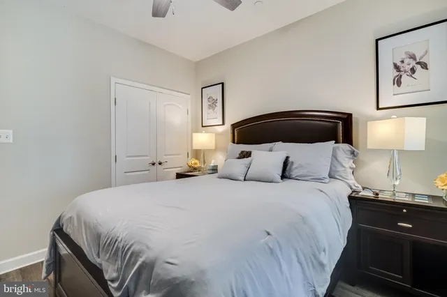 a bedroom with a bed and a lamp