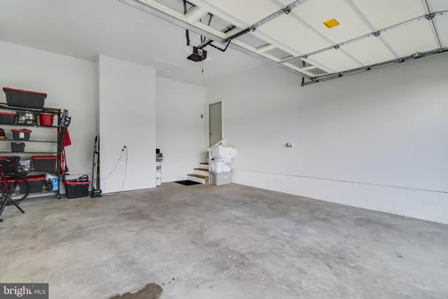 a view of a garage with rack and bicycle
