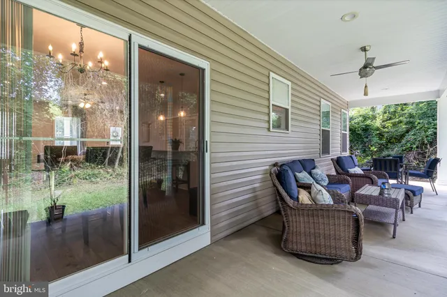 a outdoor space with patio the couches and a dining table with garden view