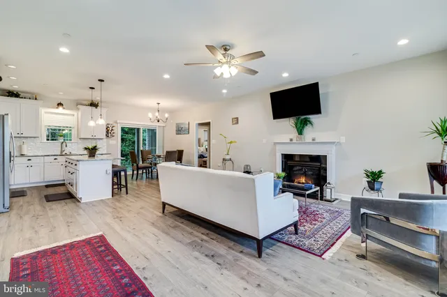 a living room with furniture fireplace and flat screen tv