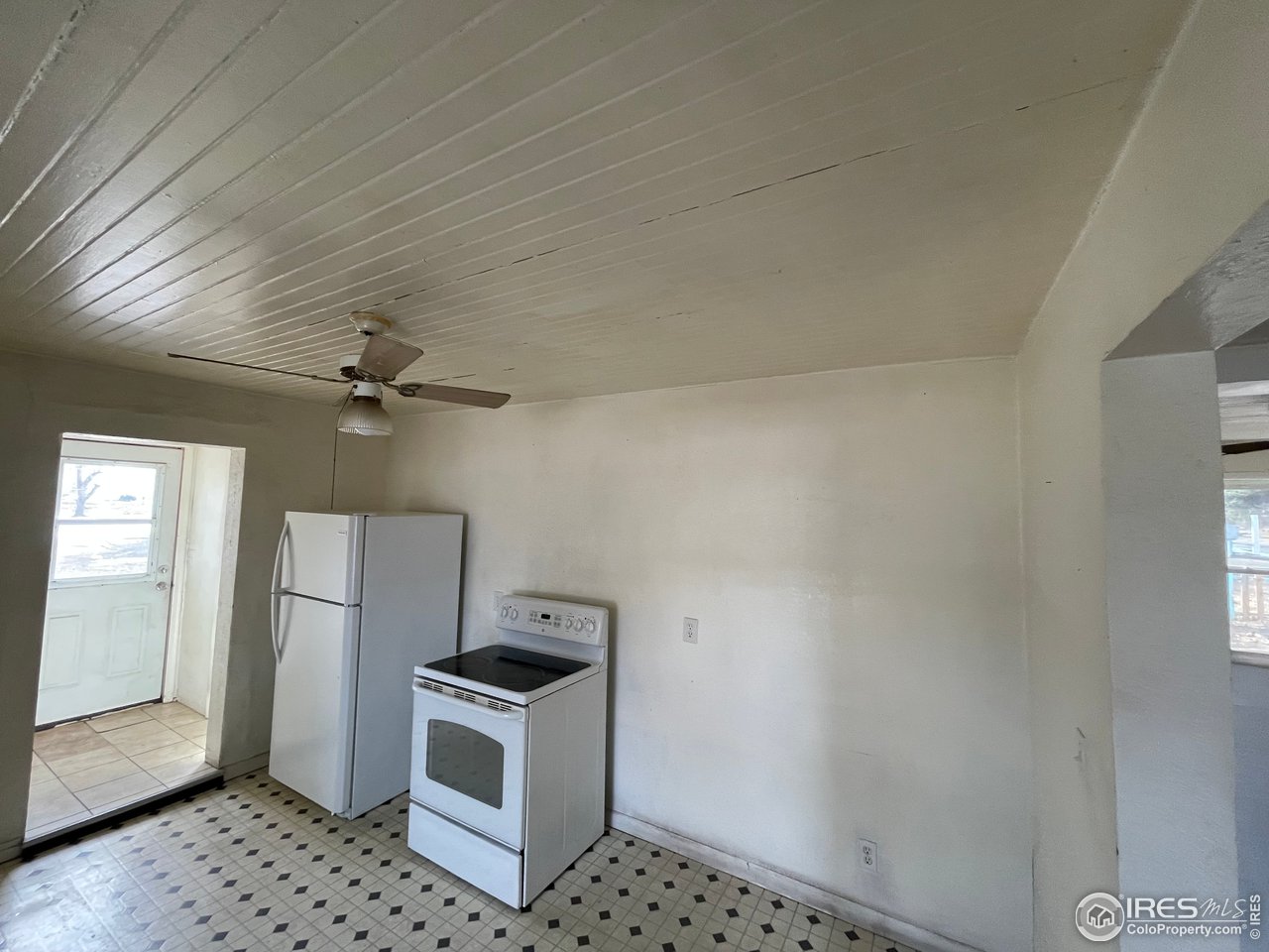 101 Reed Place Longmont, CO 80504 - Photo 11 of 34 a kitchen with stainless steel appliances a refrigerator a stove a microwave and cabinets