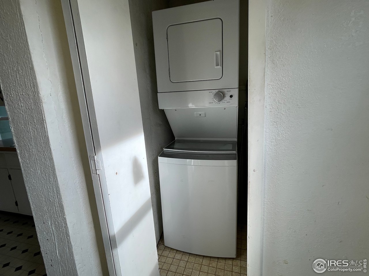 101 Reed Place Longmont, CO 80504 - Photo 13 of 34 a utility room with wooden floor washer and dryer