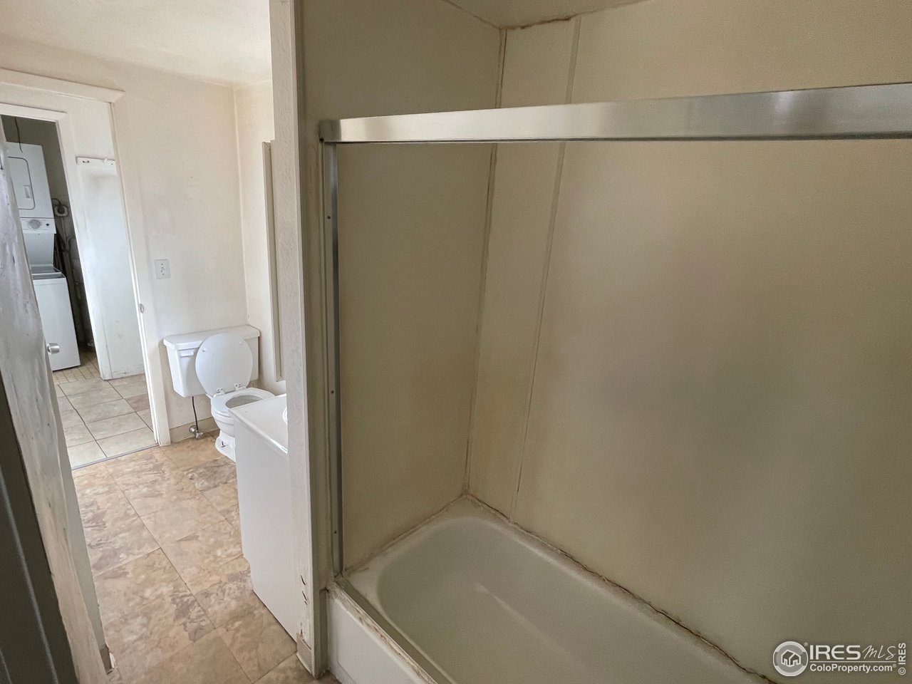 101 Reed Place Longmont, CO 80504 - Photo 17 of 34 a bathroom with a granite countertop shower and a toilet