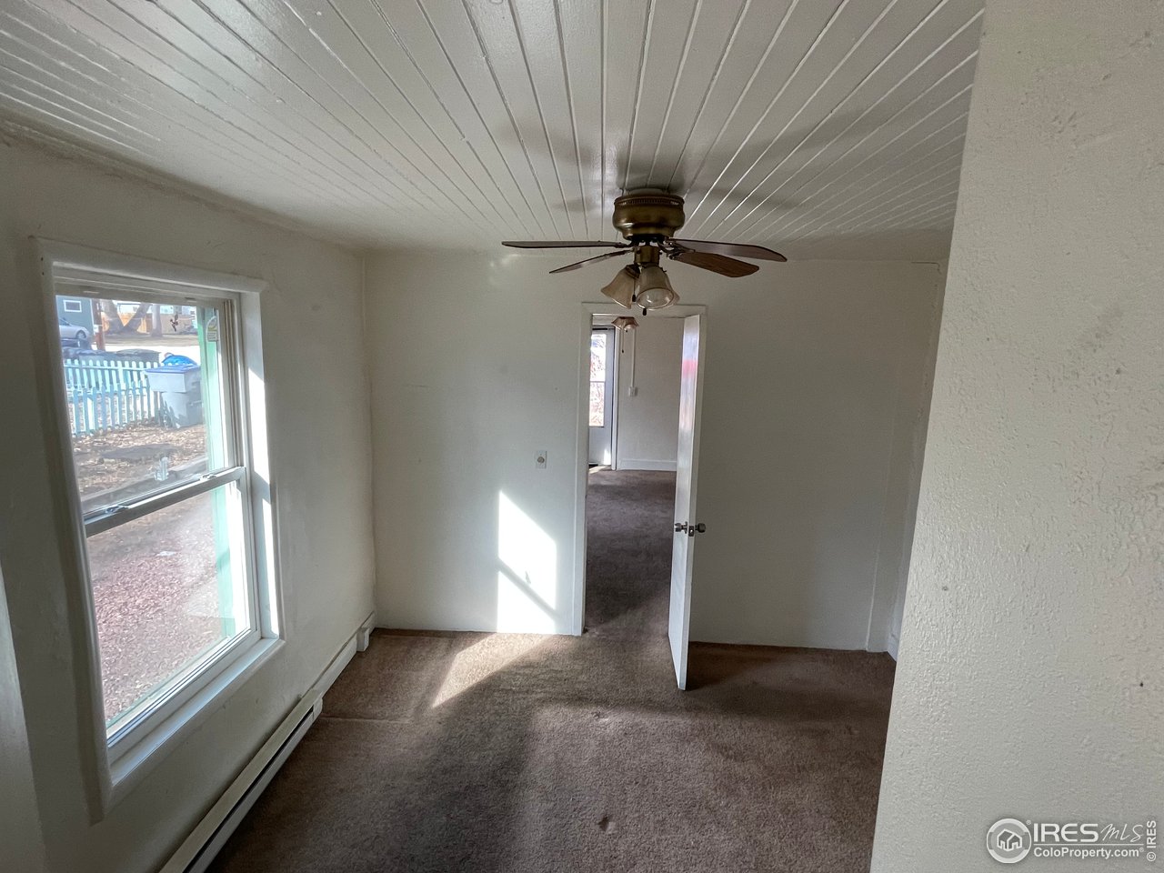 101 Reed Place Longmont, CO 80504 - Photo 18 of 34 a view of an empty room with a window