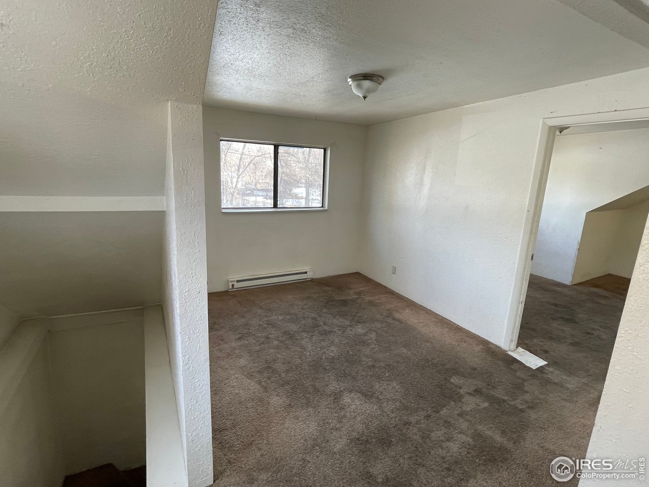 101 Reed Place Longmont, CO 80504 - Photo 24 of 34 an empty room with windows