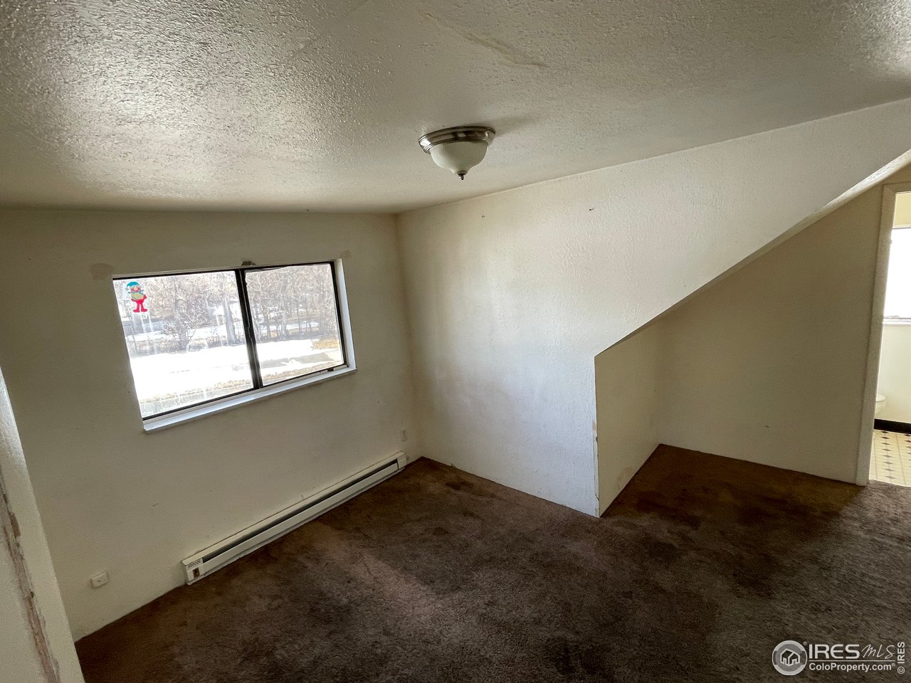 101 Reed Place Longmont, CO 80504 - Photo 26 of 34 an empty room with windows