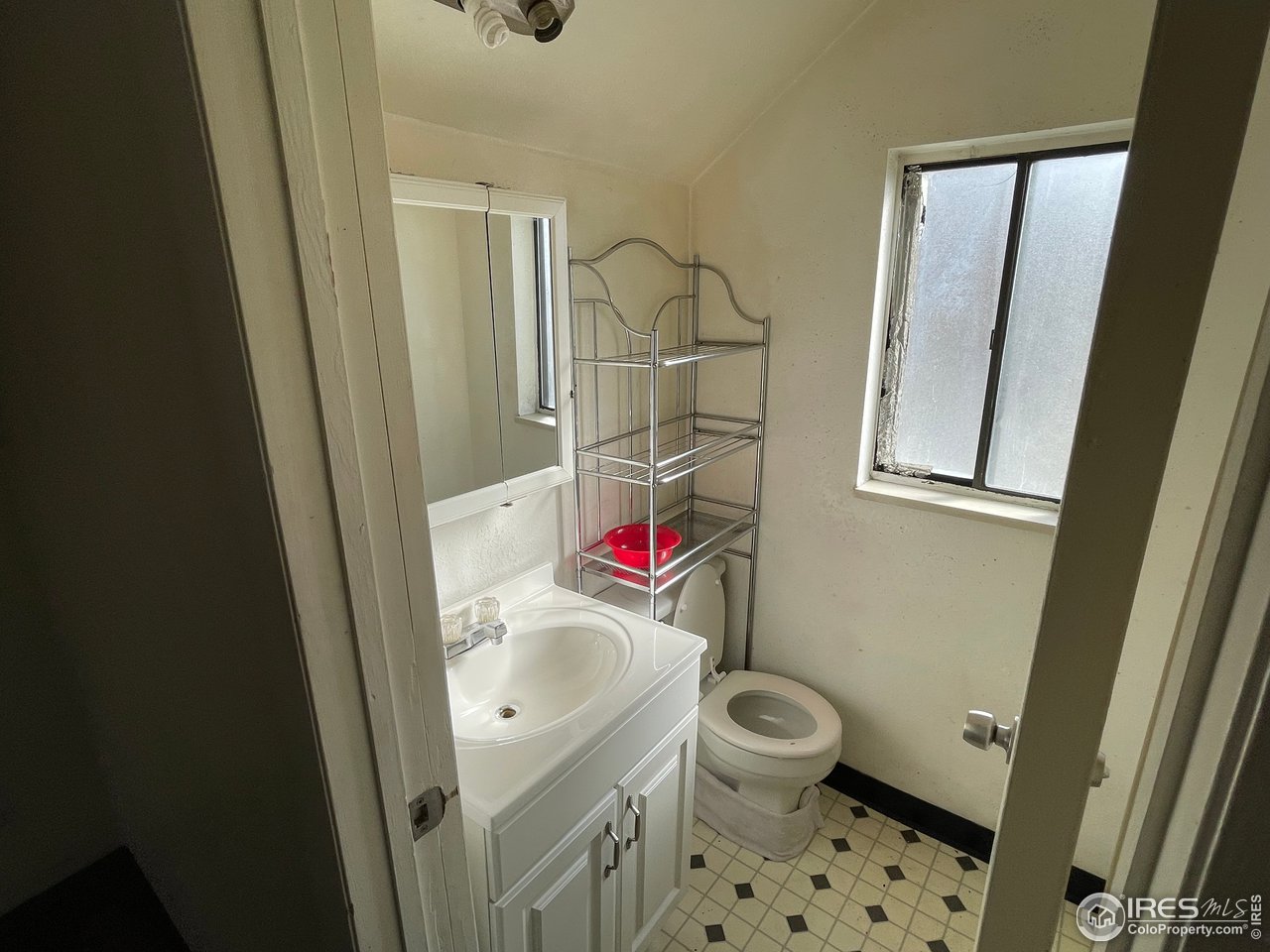 101 Reed Place Longmont, CO 80504 - Photo 29 of 34 a bathroom with a sink toilet vanity and shower