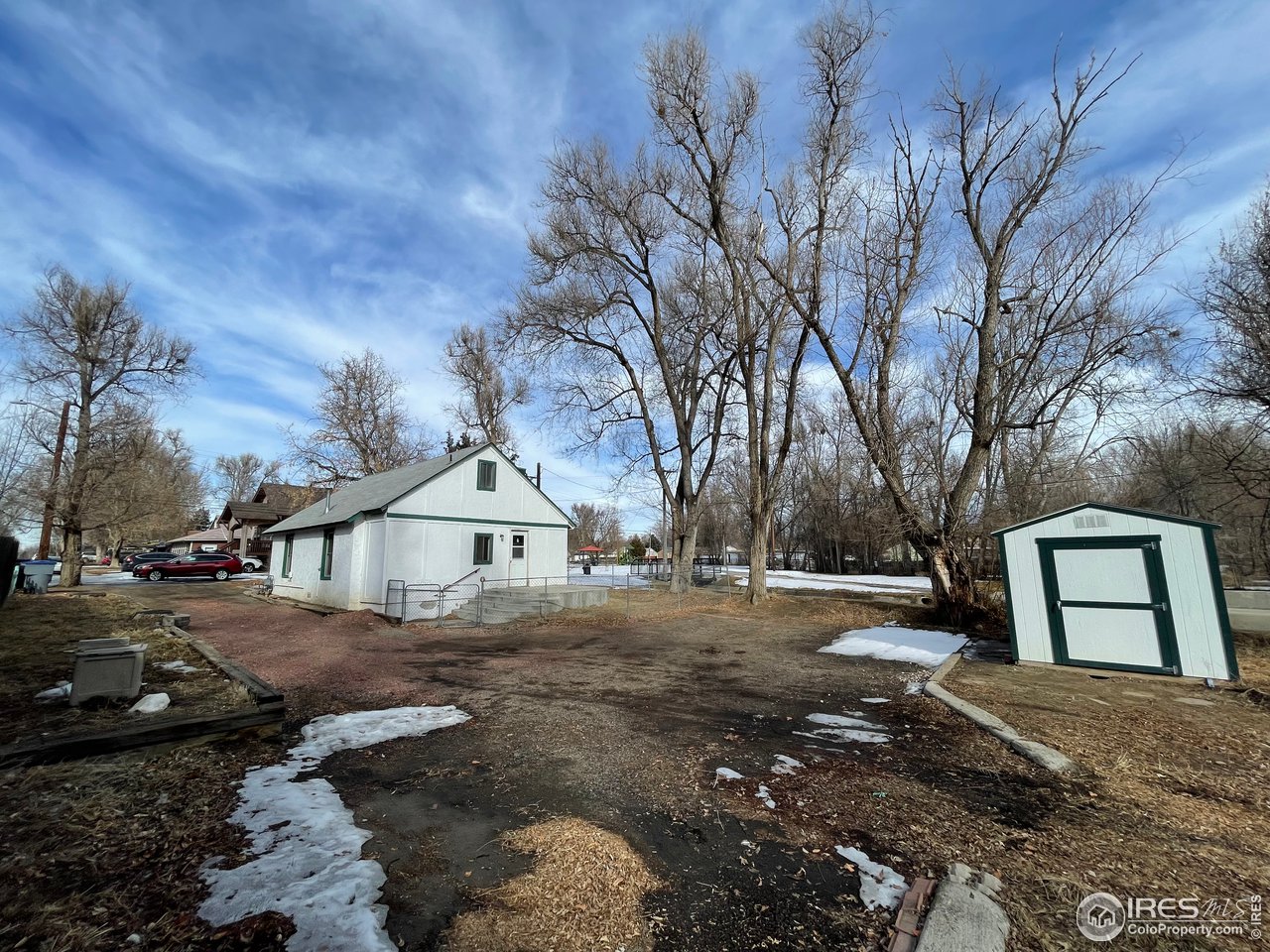 101 Reed Place Longmont, CO 80504 - Photo 4 of 34 a front view of a house with a yard and garage