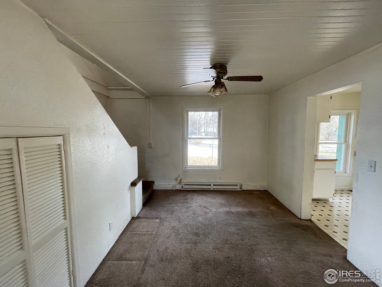 101 Reed Place Longmont, CO 80504 - Photo 9 of 34 a view of empty room with windows