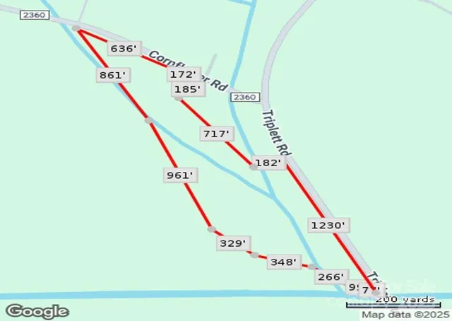 a view of a field with an ocean