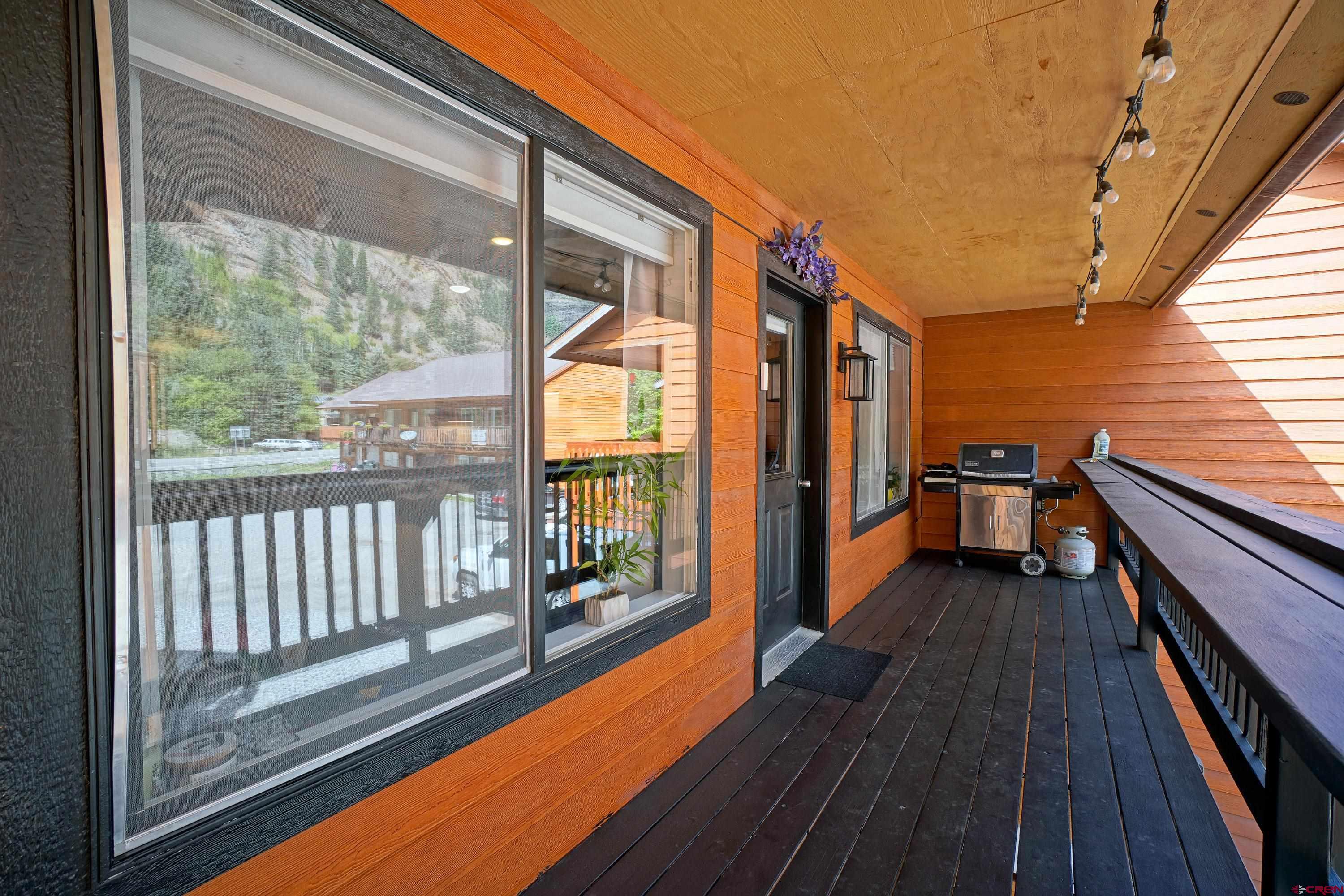 1316 Main Street Ouray, CO 81427 - Photo 20 of 39 a view of balcony with floor to ceiling windows with wooden floor