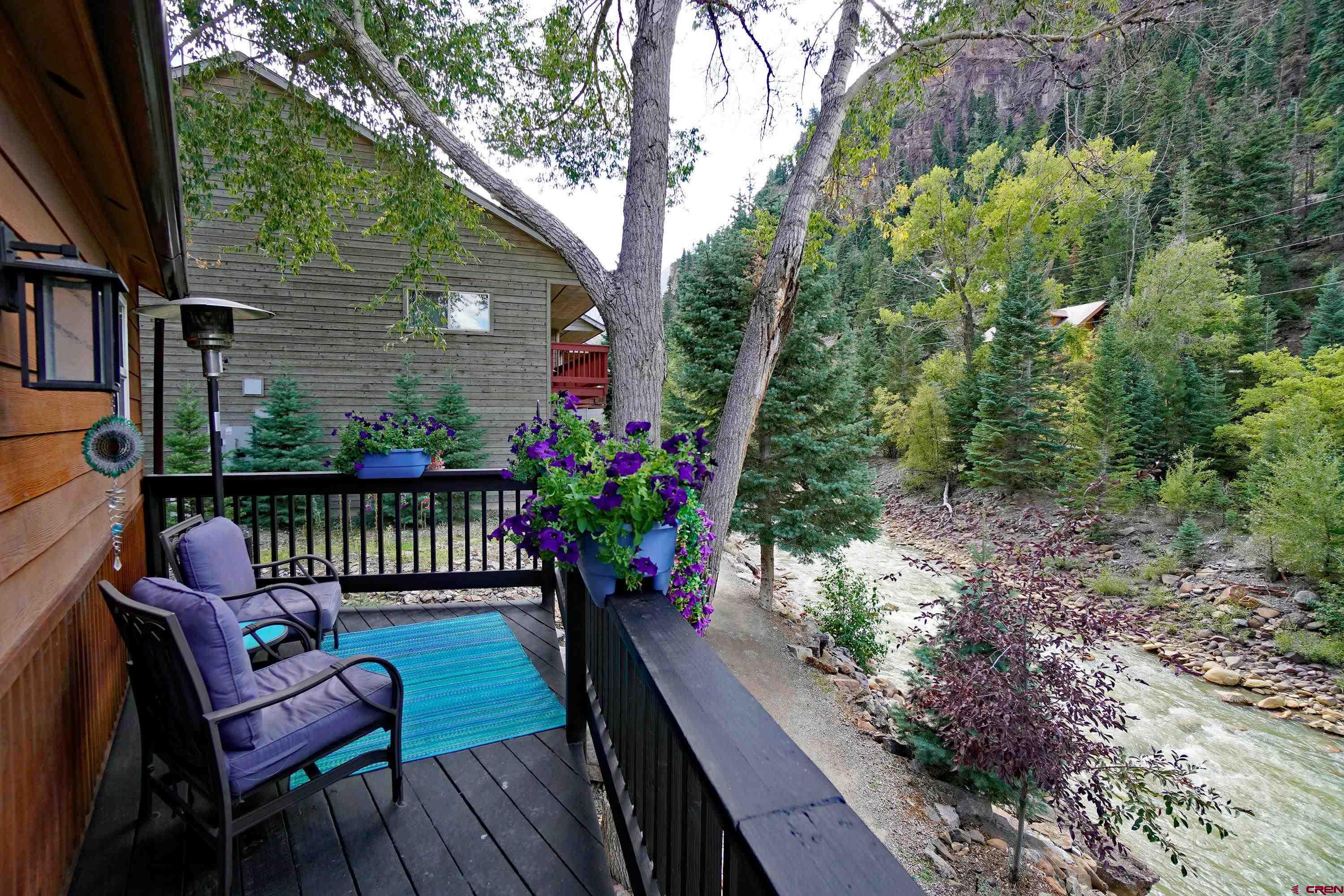 1316 Main Street Ouray, CO 81427 - Photo 27 of 39 a view of a wooden chairs and bench in the balcony