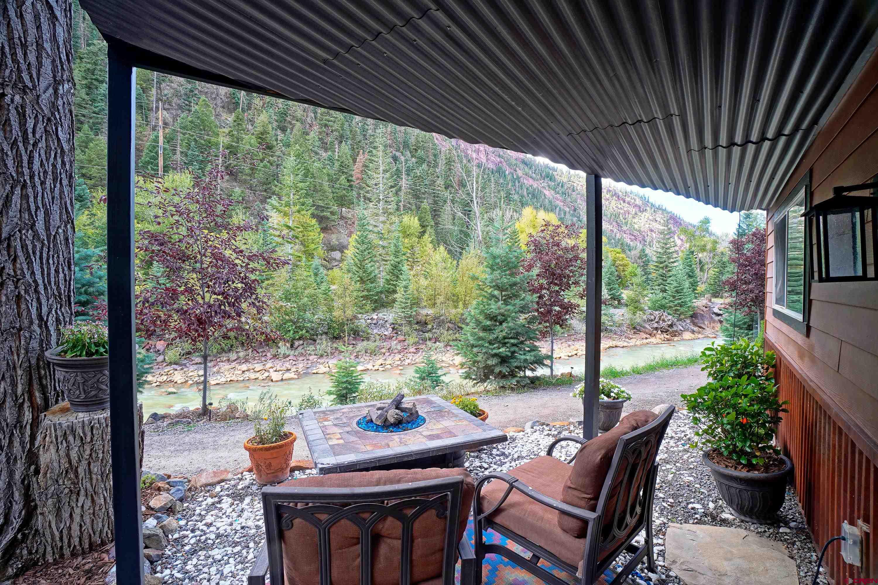 1316 Main Street Ouray, CO 81427 - Photo 34 of 39 a outdoor dining space with furniture and garden view