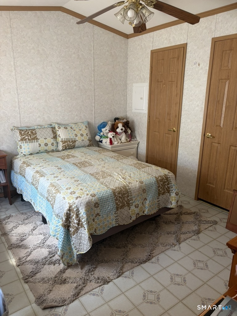 62 Fort Hill Road Groton, CT 06340 - Photo 8 of 11 a bedroom with a bed and a mirror
