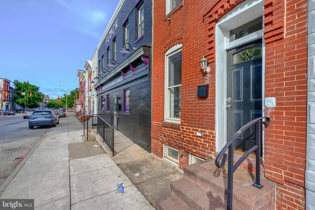a view of a building with sitting area
