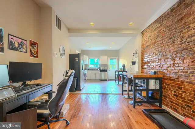 a view of a livingroom with furniture and a flat screen tv