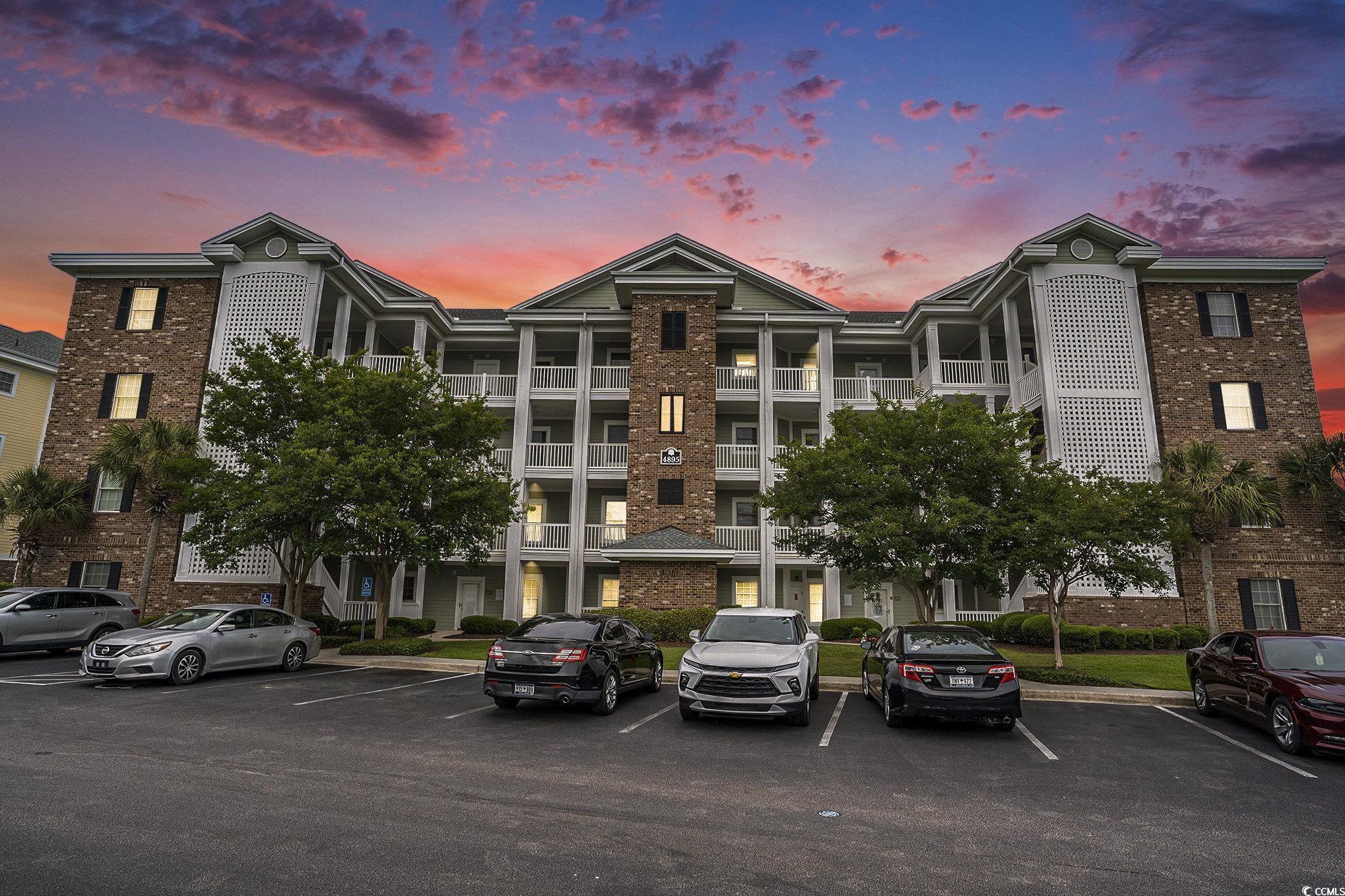 4895 Luster Leaf Circle, Unit 302 Myrtle Beach, SC 29577 - Photo 1 of 20 Property at dusk with uncovered parking