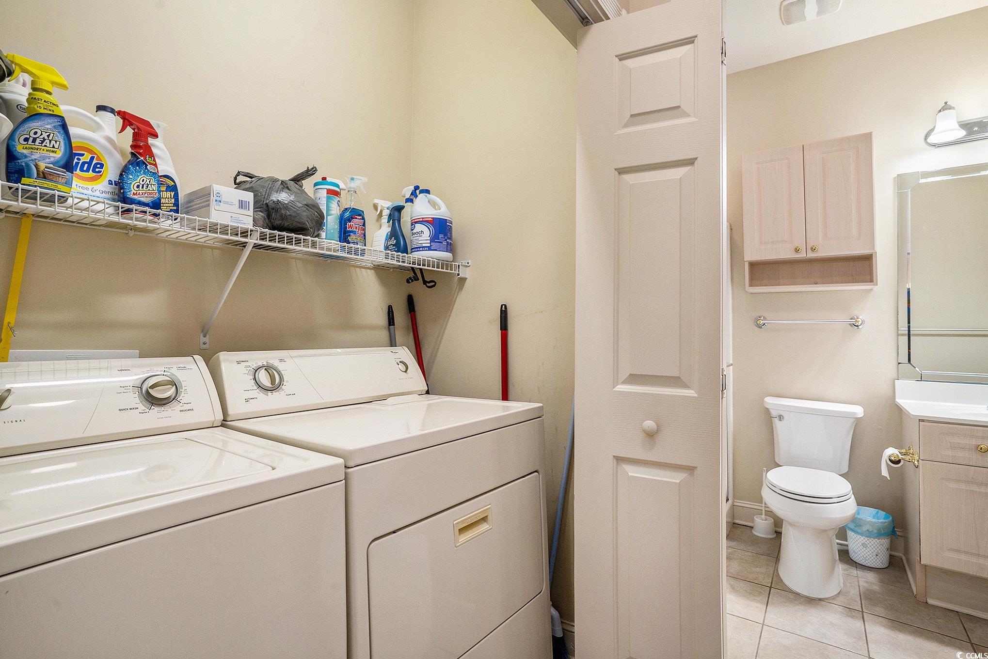 4895 Luster Leaf Circle, Unit 302 Myrtle Beach, SC 29577 - Photo 14 of 20 Clothes washing area featuring light tile patterne