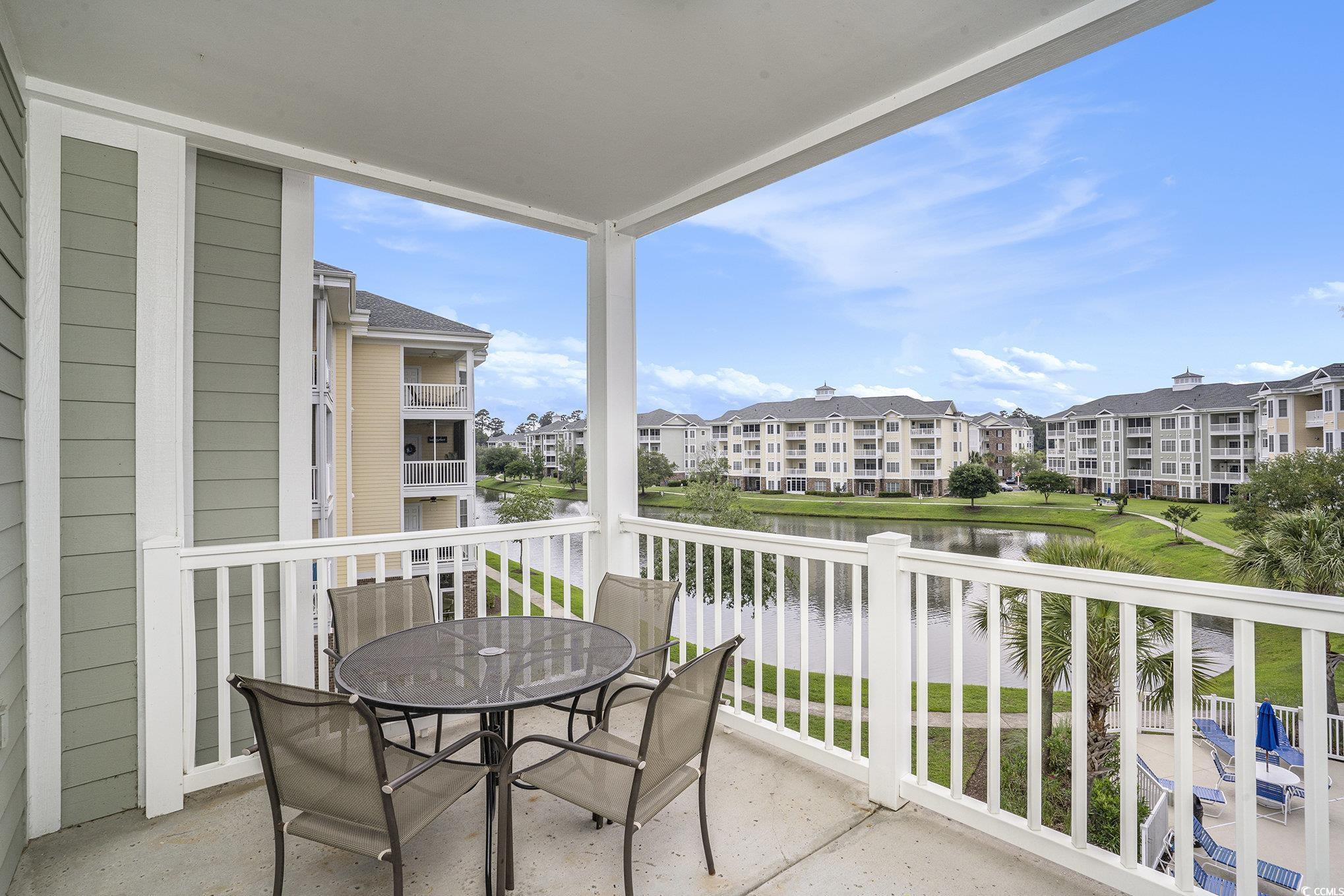 4895 Luster Leaf Circle, Unit 302 Myrtle Beach, SC 29577 - Photo 15 of 20 Balcony featuring a water view, outdoor dining are
