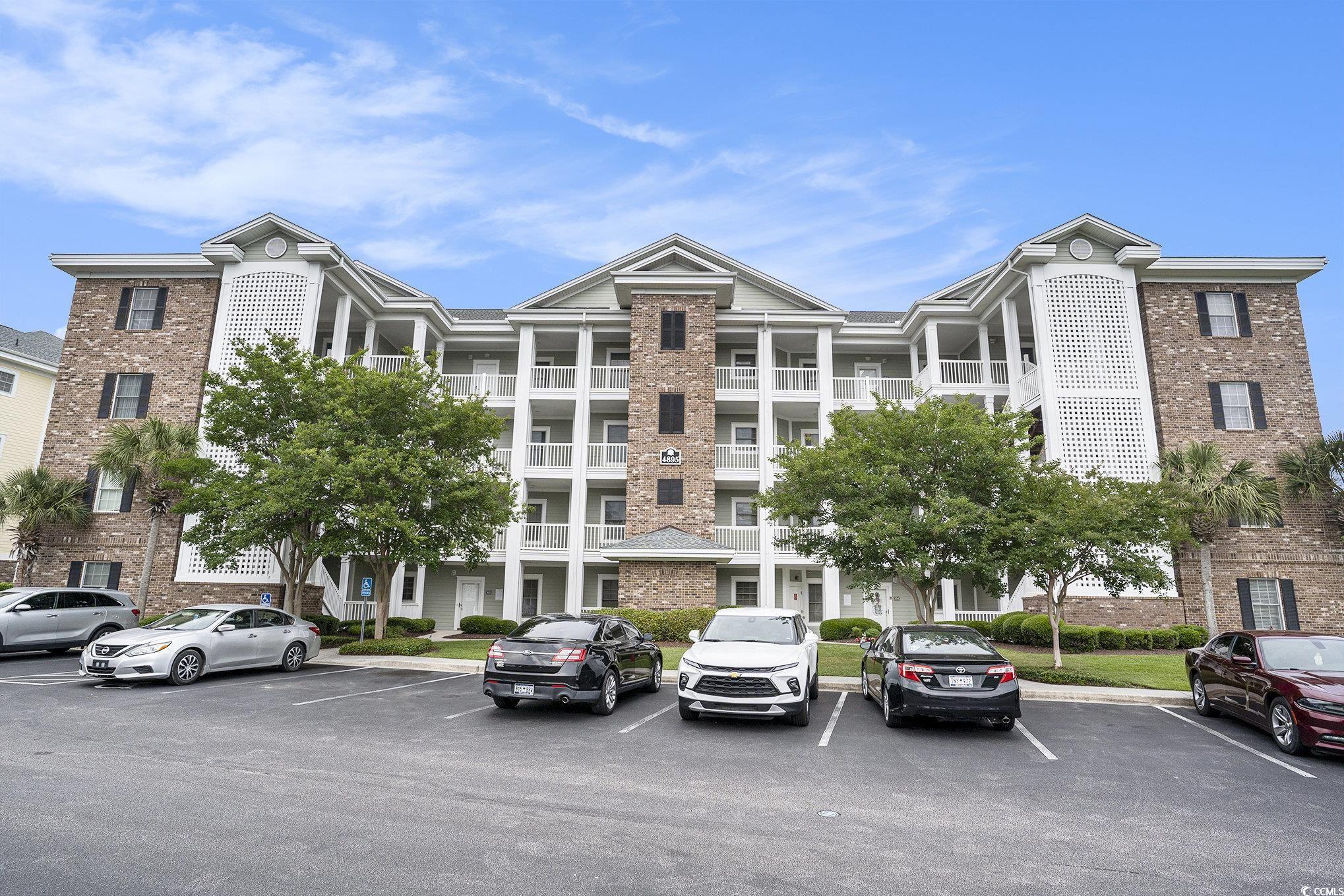 4895 Luster Leaf Circle, Unit 302 Myrtle Beach, SC 29577 - Photo 2 of 20 View of apartment building / complex featuring unc